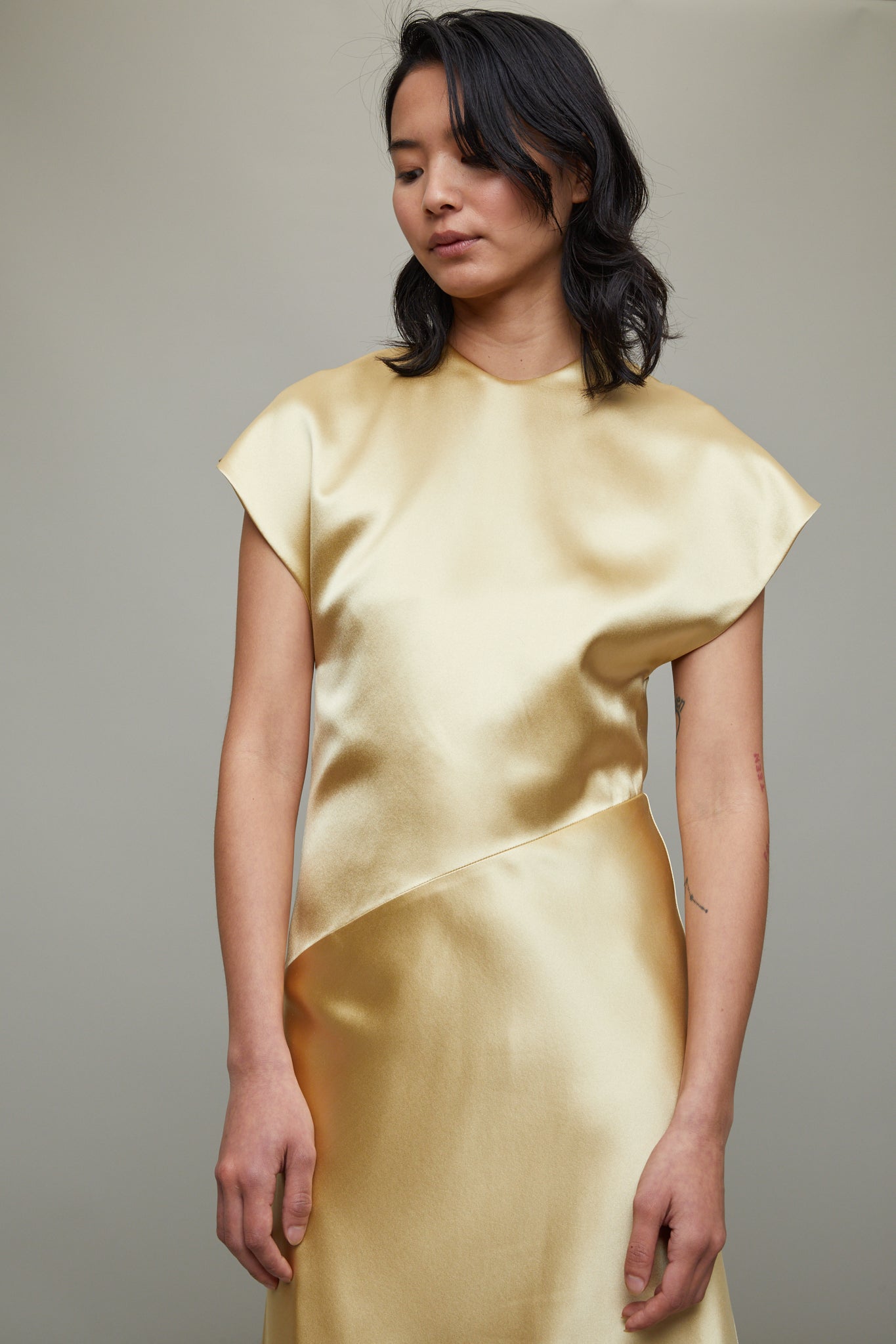 tove gold dress tovestudio's Kezia Dress captures a festive mood with its soft silhouette and metallic shine